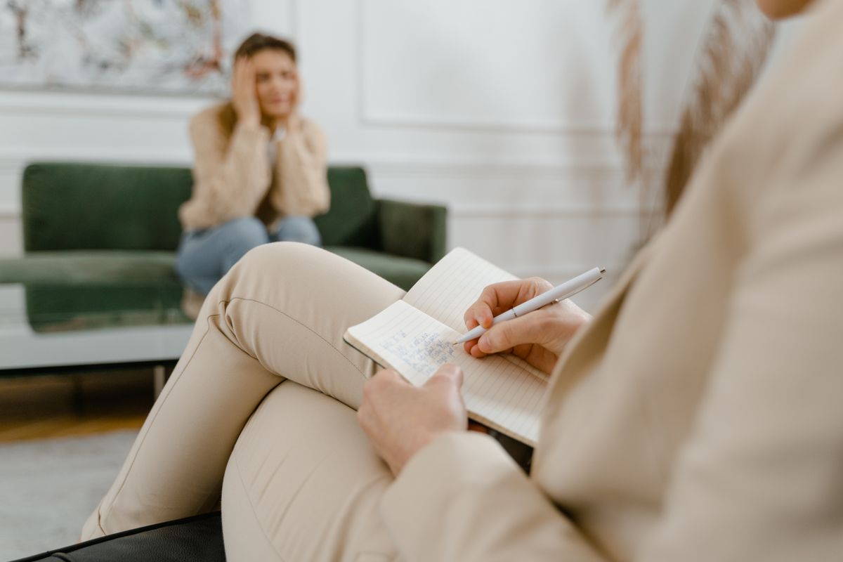 A therapist making notes